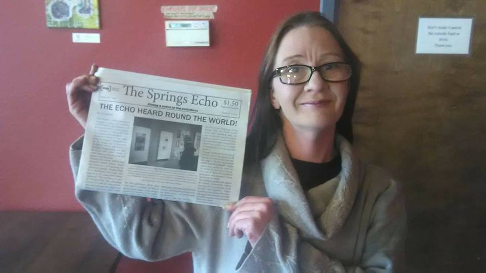 Raven pictured with issue 2 of The Springs Echo. Credit: Facebook