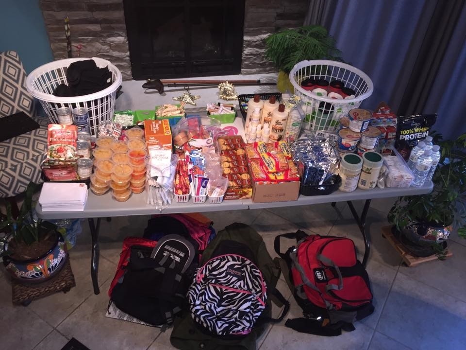 Volunteers pack backpacks with non perishable food, toiletries and more to hand out on Nashville's streets. Credit: Jessica Thurmond