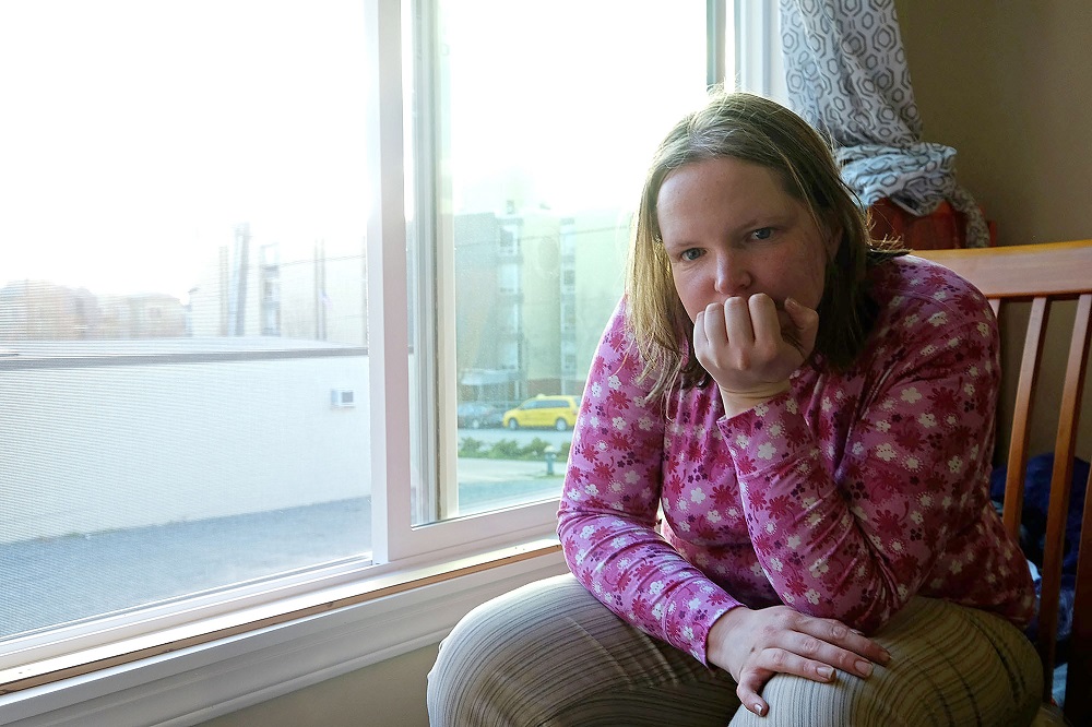 Lisa Sawyer in her apartment in Seattle's Greenwood neighborhood, Thursday March 16, 2017. Photo: Real Change