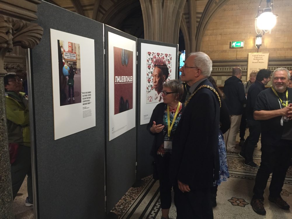 Fay Selvan and Lord Mayor Eddy Newman view the UNCOVERED street paper art exhibition 