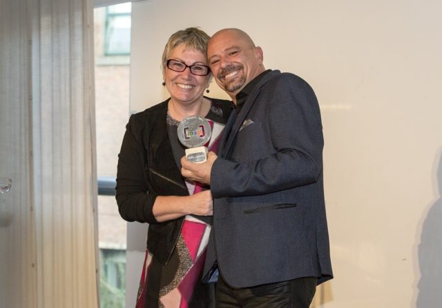 Serge Lareault receiving his award with Fay Selvan, INSP Chair. Photo by Rebecca Lupton.