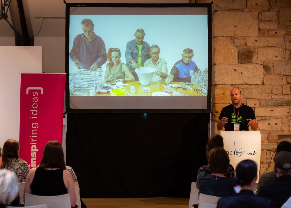 Chris Alefantis speaking at the INSP Talks about Shedia's upcycling project, Shediart. Credit: Jack Donaghy