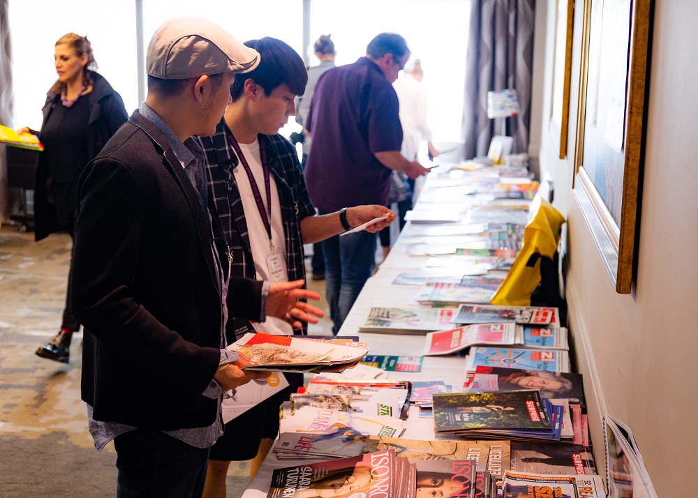 Delegates browse a selection of international street papers. Credit: Jack Donaghy