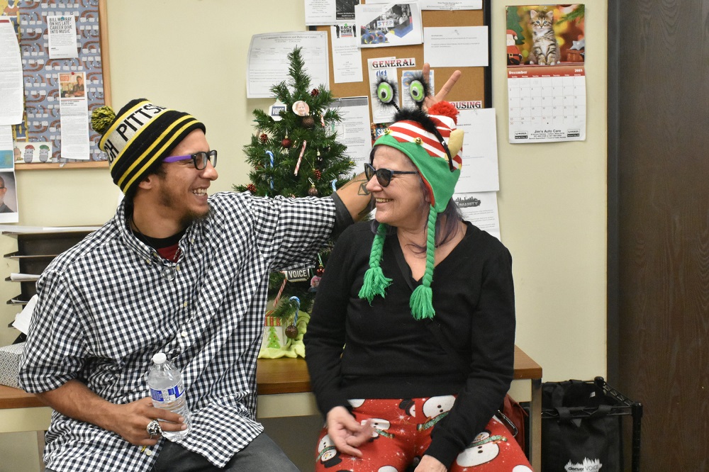 RAELENE JOHNSON AND HER SON, JAMAR, MET FACE-TO-FACE FOR THE FIRST TIME IN OVER 20 YEARS IN DECEMBER. JAMAR VISITED THE VOICE OFFICE WITH RAELENE TO MEET FELLOW VENDORS AND STAFF ON DECEMBER 13. (CREDIT: SARAH FORD)