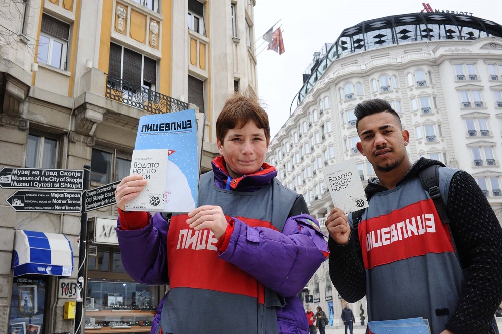 Lice v Lice vendors with the current issue of the street paper and the poetry book