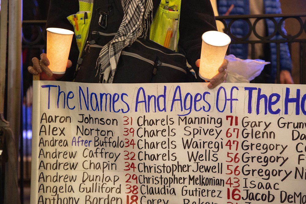 Just before sunset a group of faith leaders, homeless advocates and formerly homeless people gatthered at the Tree of Life statue remember those who died outside this year. As each of the names were read aloud, the group repeated the phrase "We Remember." (Credit: Matthew S. Browning)