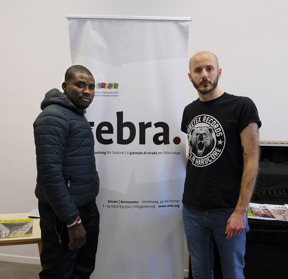 zebra. staff member Alessio Giordano (right) with zebra. vendor Geoffrey Onodu. (Credit: Anna Mayr)