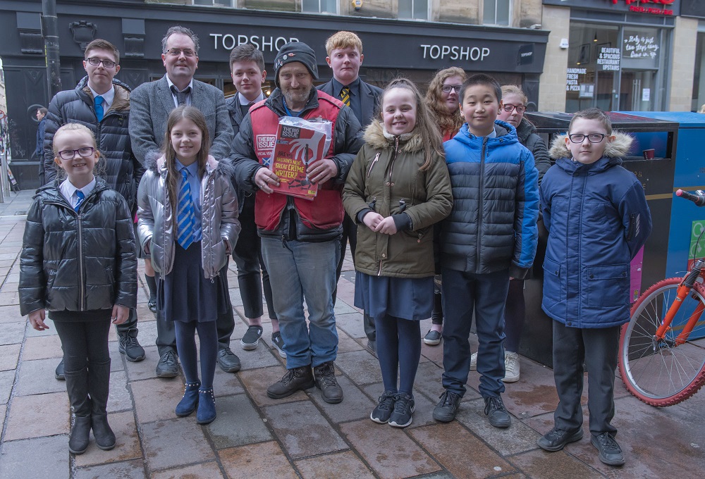 The pupils hear from Big Issue vendor Paul (Credit: Jamie McFadyen)