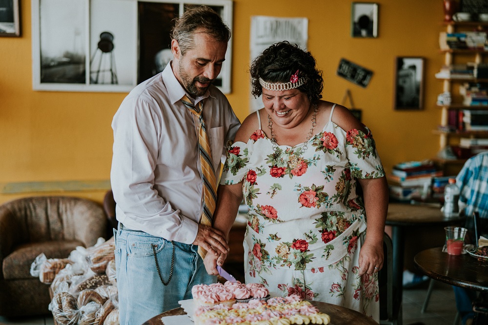 Curbside Chronicle vendors Mark and Rene pose for a wedding portrait.. (Credit: Ben Birdwell)