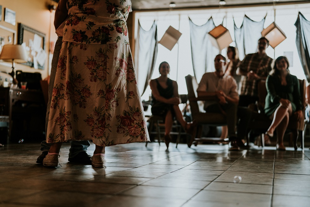 Mark and Rene share their first dance at their wedding. The couple got married at one of their favorite coffee shops, Joe's Addiction. (Credit: Ben Birdwell)