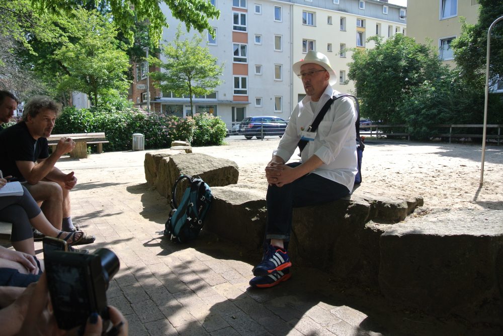 Thomas tells his story at a local park.