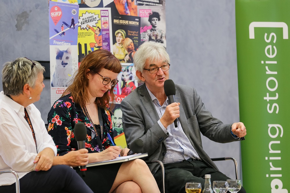 On stage, from left to right: Fay Selvan, Hannele Huhtala, Mel Young. (Credit: Andreas Fuchs)