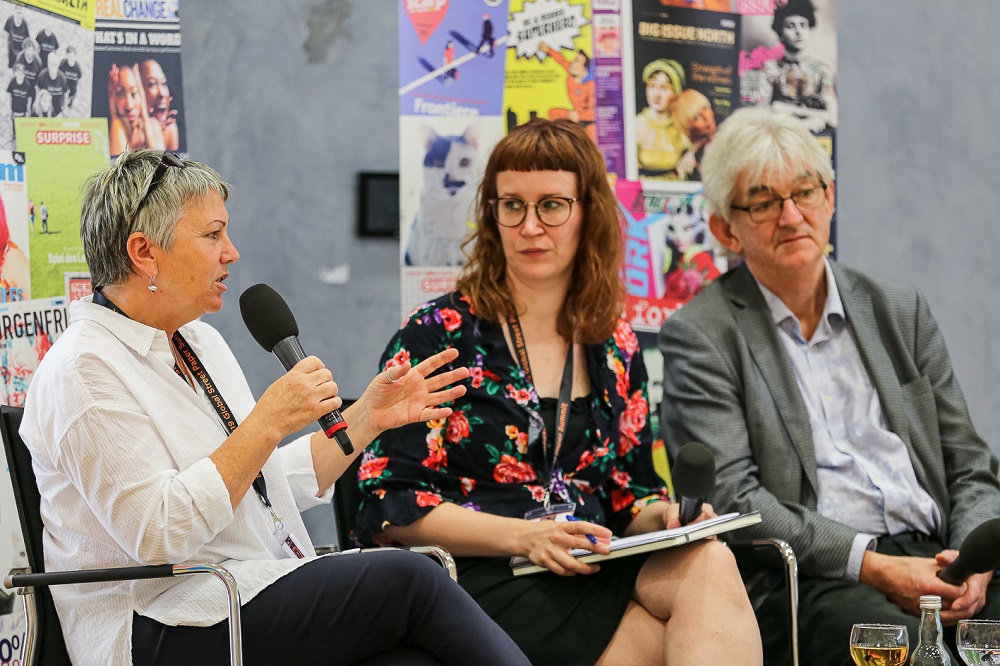 On stage, from left to right: Fay Selvan, Hannele Huhtala, Mel Young. (Credit: Andreas Fuchs)