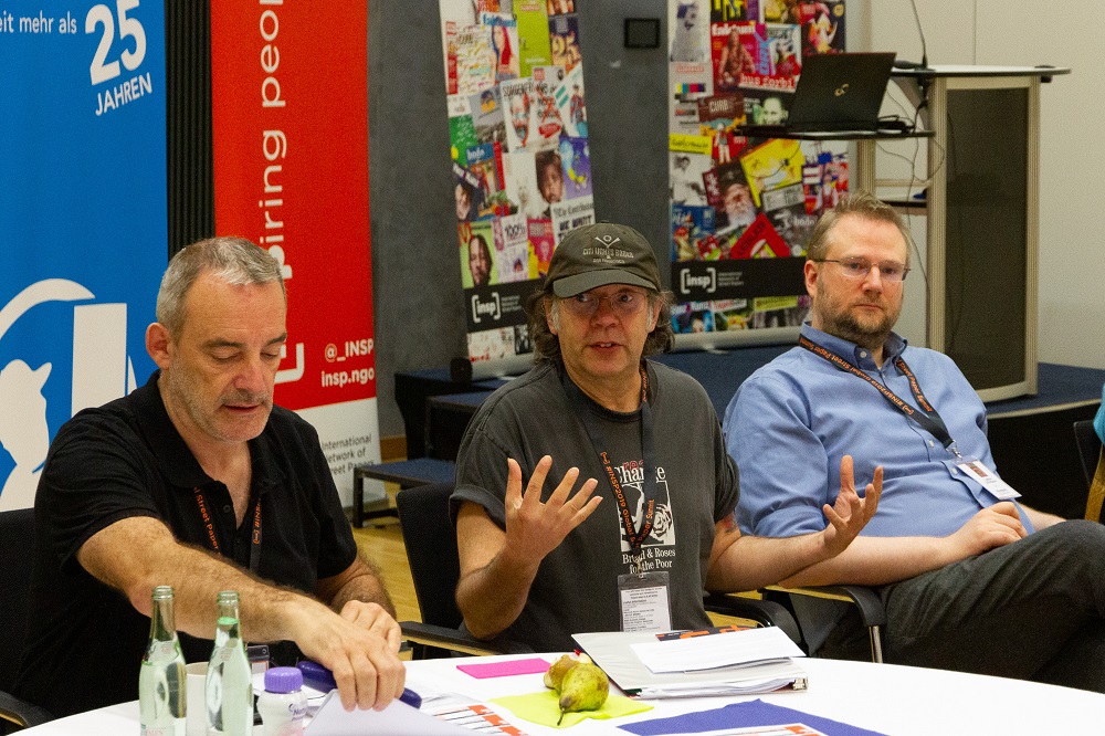 Tim Harris (centre), Real Change founding director and INSP board member, at the 2019 Global Street Paper Summit in Hannover. [Credit: Sebastian Sellhorst]