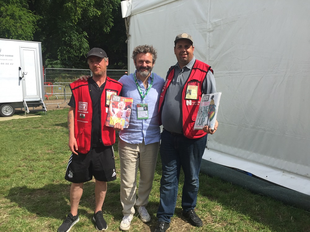 Michael Sheen with Big Issue vendors. [Courtesy of The Big Issue (UK)]