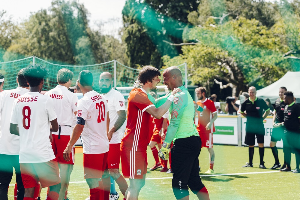 The Swiss team (left) after conceding a goal to host nation Wales. [Credit: Homeless World Cup / Mile 44 (www.milefortyfour.com]