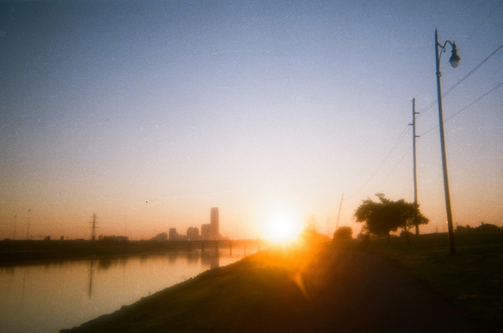 A sunrise over the Oklahoma River.