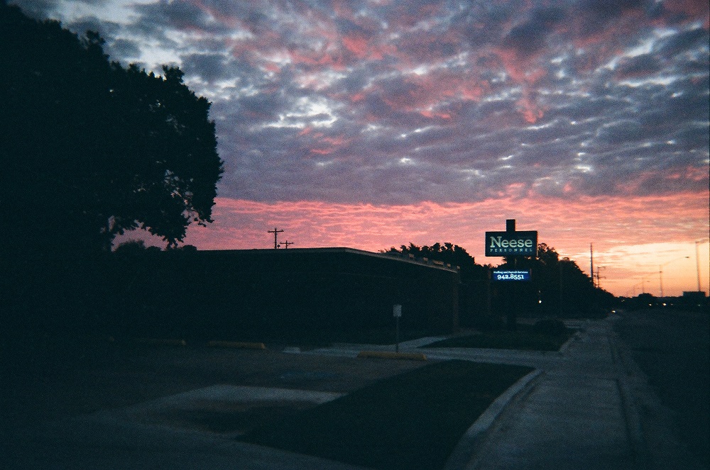 A pink and blue clouds during a sunset.