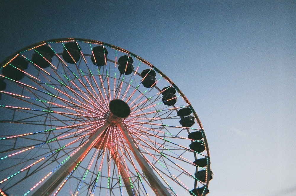 The Wheeler Ferris wheel lights up the evening sky near downtown Oklahoma City.