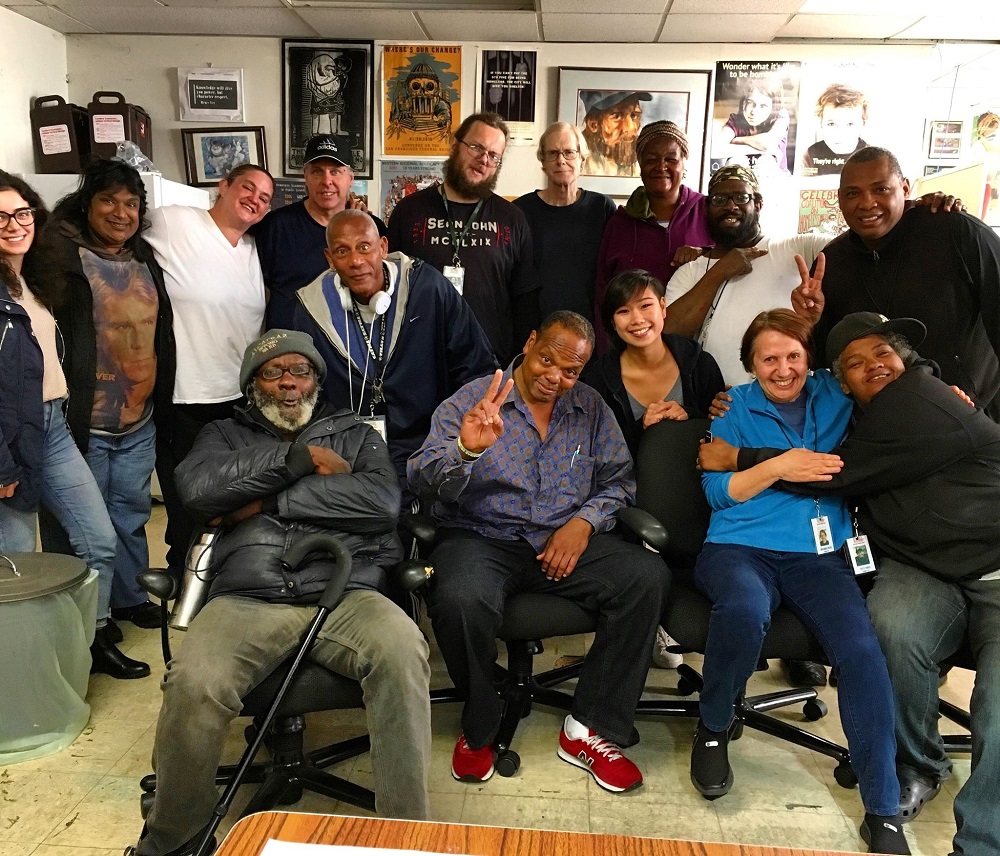 Street Sheet vendors with former Street Sheet editor Sam Lew (bottom row, second from right)