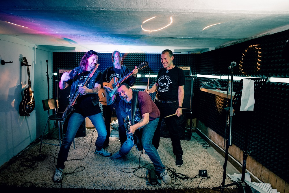 Striking the right pose: Golem, Jörg, Deerk and Duddi ( L to R) practising in the cellar of the cottage where Jörg and Golem live. [Credit: Mauricio Bustamante]