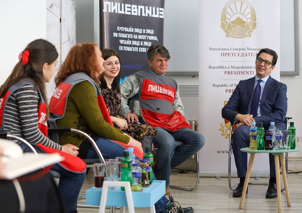 North Macedonian President Stevo Pendarovski chats with Lice v Lice vendors and their coordinator Ema Todorovska