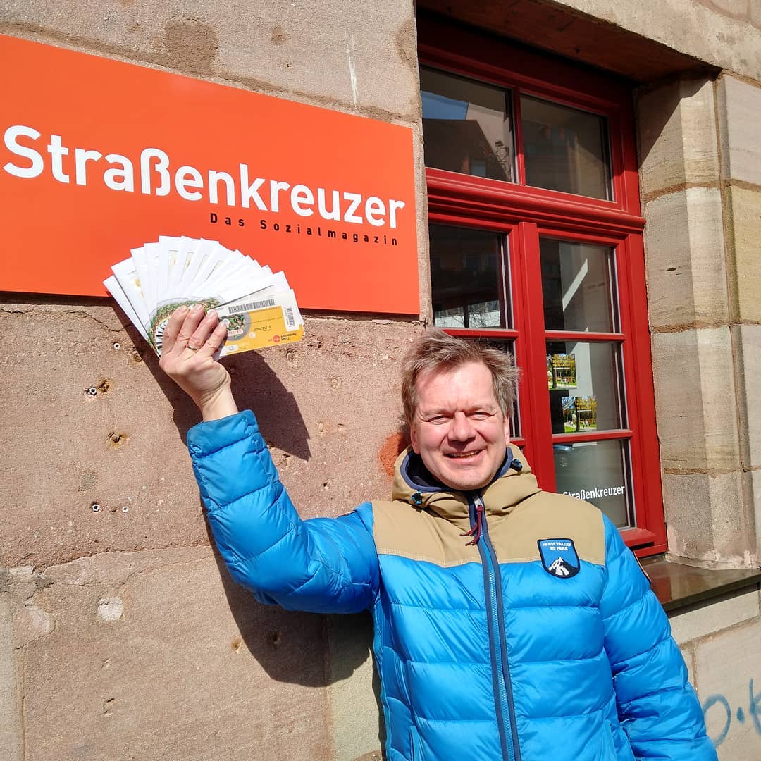 A Strassenkreuzer vendor receives shopping vouchers as part of a call to supermarket chains for assistance.