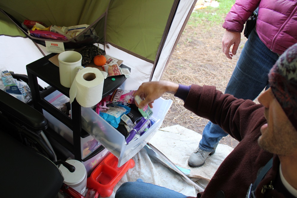 A medical tent that is part of a homeless camp in Portland is stocked with hygiene supplies. [Credit: Joanne Zuhl]