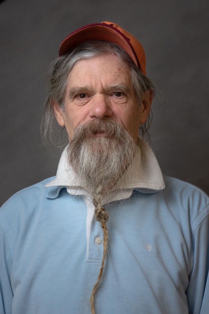 Jan, 74, was homeless for ten years. Reading from a children’s book. Jan tells Primary schools the tale of life on the street, ‘An averagely happy life’. [Credit: Mauricio Bustamante]