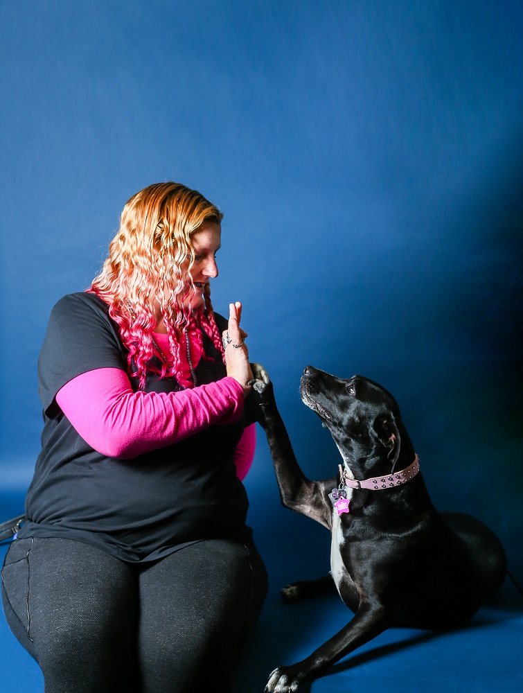 Lauren and her service dog, Tippy. This dog is very well behaved and particularly helpful calming Lauren’s anxiety. [Credit: Kathy Martin]