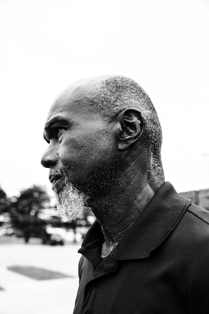 Bruce stands outside the Oklahoma City Day Shelter. He relies on the shelter for lunch on weekdays. [Credit: Nathan Poppe]