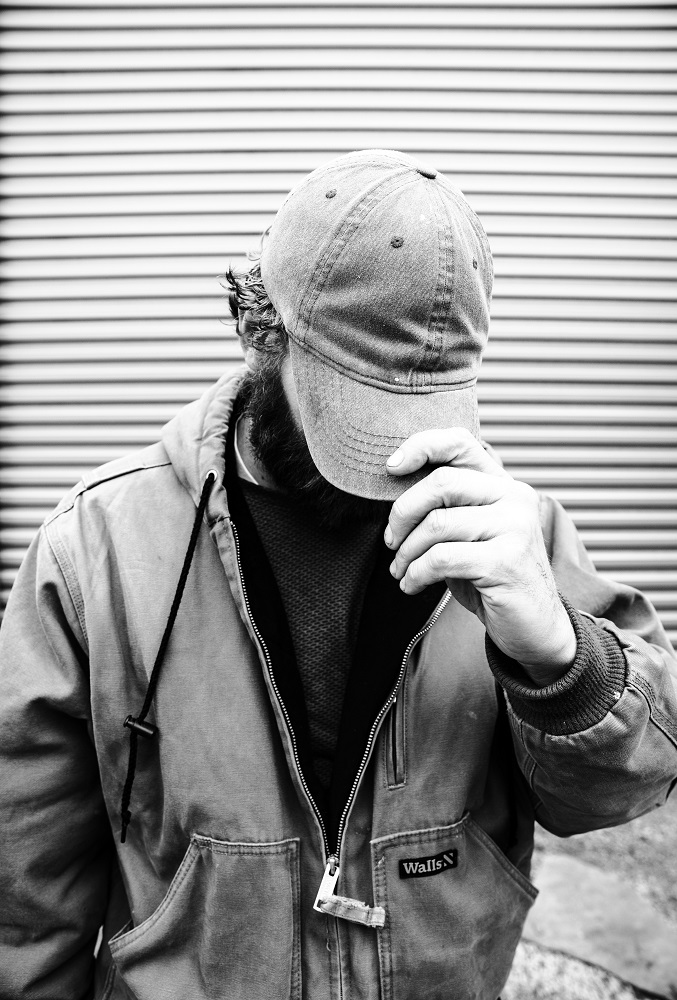 Nathan was willing to be interviewed but wasn’t comfortable showing his face in a portrait. He said his struggle with addiction was complicated by COVID-19. [Credit: Nathan Poppe]