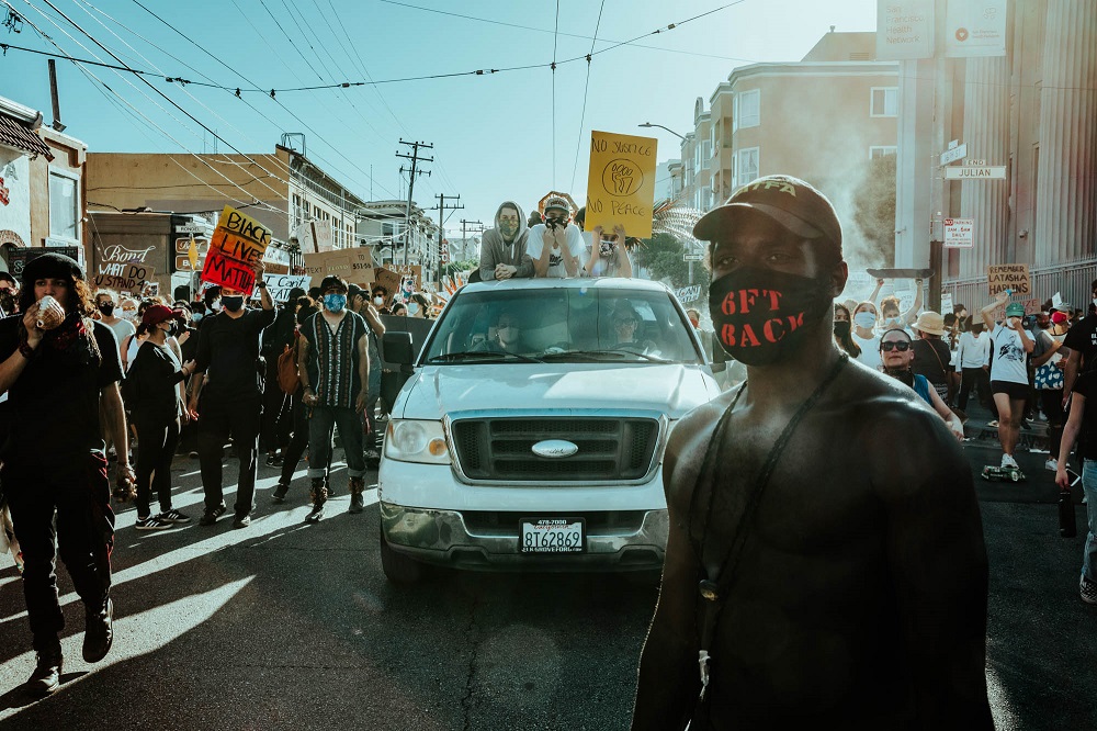 Protesters march down 16th street. [Credit: Kit Castagne]