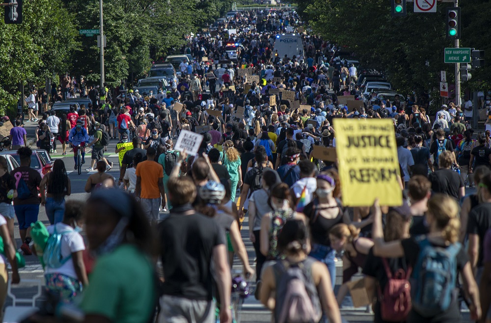 Protestors crowd 16th Street as they move toward the White House on June 6, 2020 in Washington, D.C. Photo courtesy of Cody Bahn / Street Sense