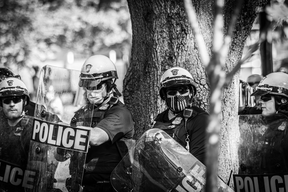 U.S. Park Police officers in riot gear form a line in Lafayette Square Park on Sunday, May 31. Photo by Benjamin Burgess.