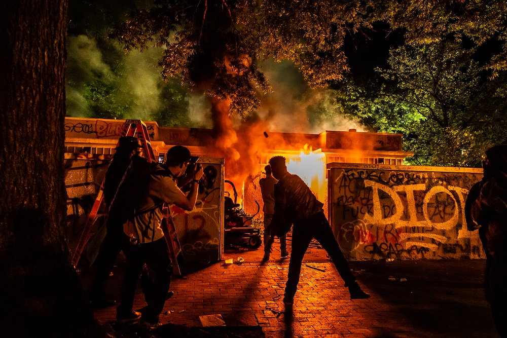 Someone set a public restroom in Lafayette Square Park on fire after the 11 p.m. curfew on Sunday, May 31. Photo by Benjamin Burgess.