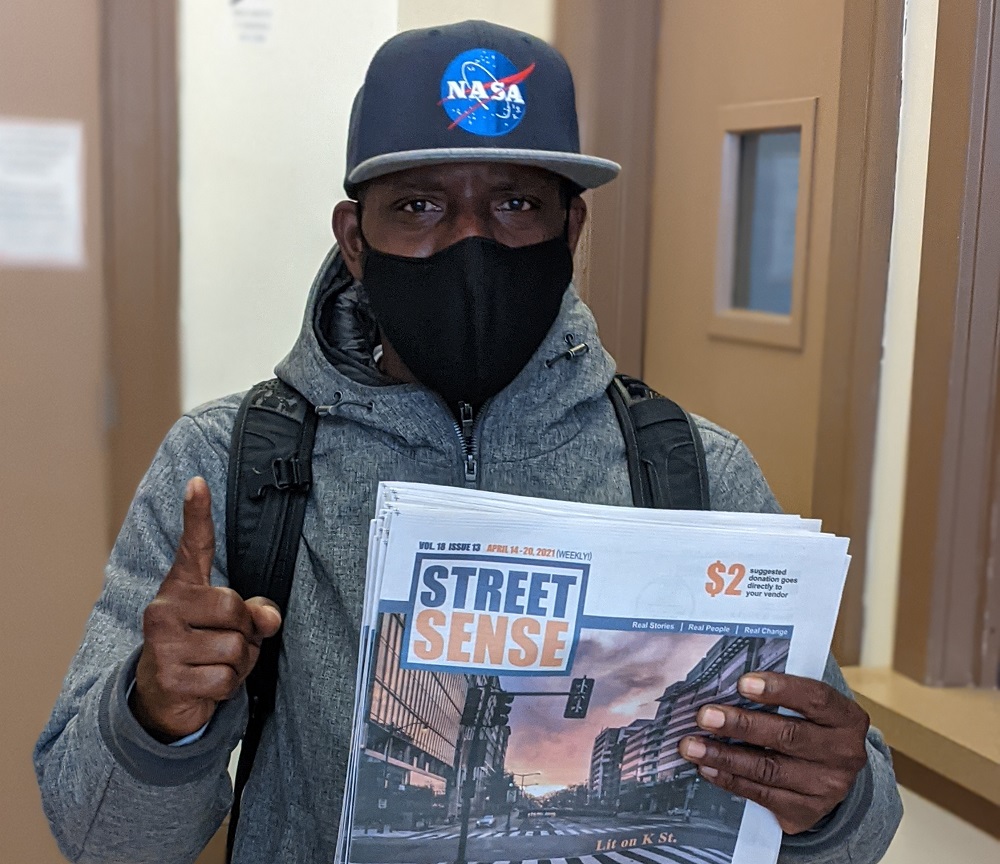 Street Sense vendor Ron 'Pookabu' Dudley, who interviewed the Chuck D and Tom Morello featuring rock/rap supergroup Prophets of Rage for the street paper network in 2016. [Credit: Doris Warrell]