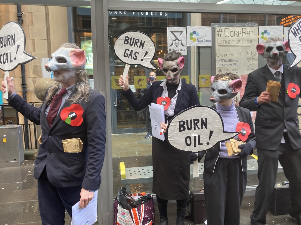 All sorts lined the streets as the protest moved through the city. Here, a troupe of actors portrayed a group of 'coroporate rats' financially benefitting from the climate crisis.