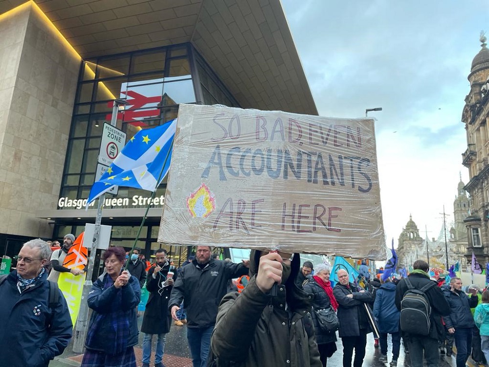 Protestor's signage was a mix of serious and funny. "So bad, even accountants are here".