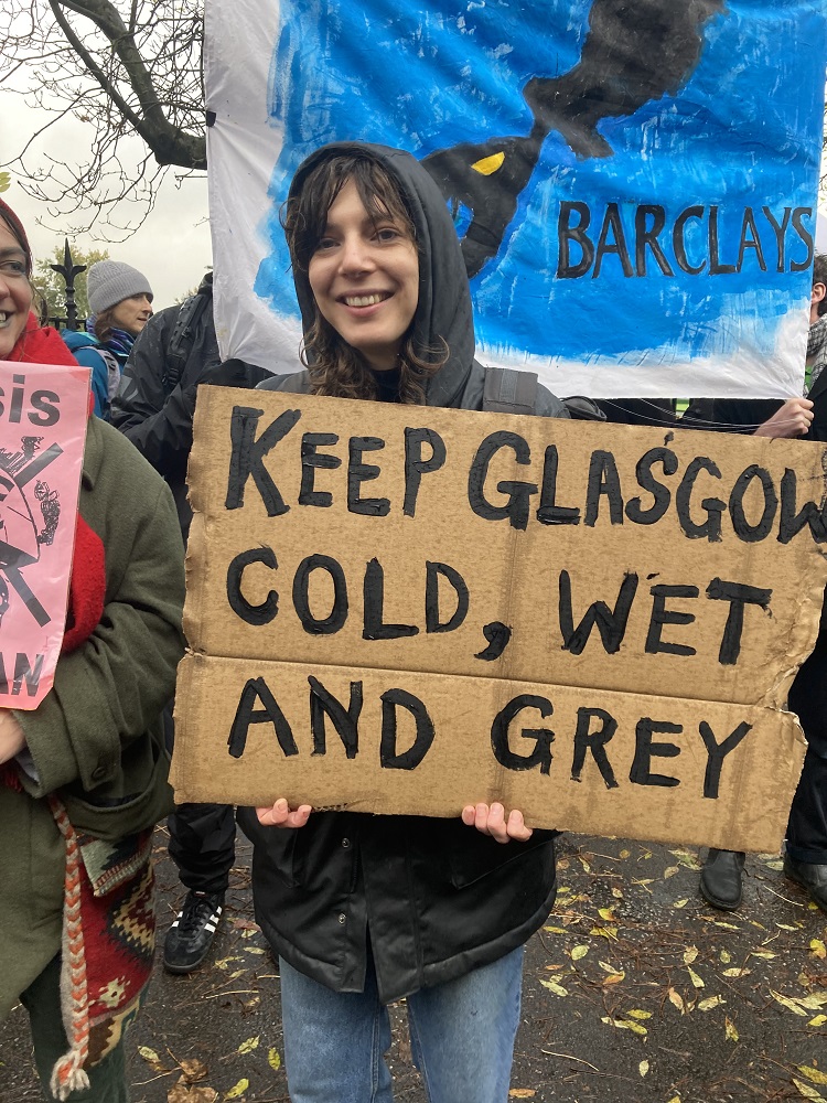Protesting for climate justice, with a Glaswegian twist: "Keep Glasgow cold, wet and grey".