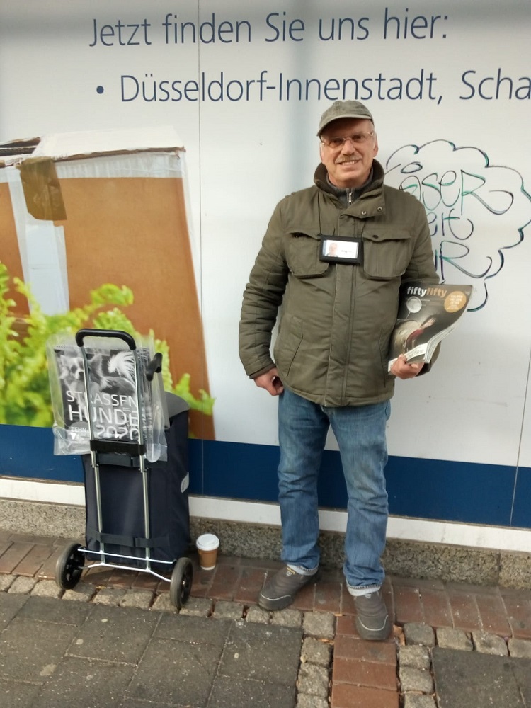 He needs the streets and the streets need him: Rudolf Druschke, known as the lovely Rudi by his customers, has stood at the same spot 'Am Dreieck' on Düsseldorf’s Nordstraße every day selling fiftyfifty for 24 years. [Credit: Hans Peter Heinrich / fiftyfifty]