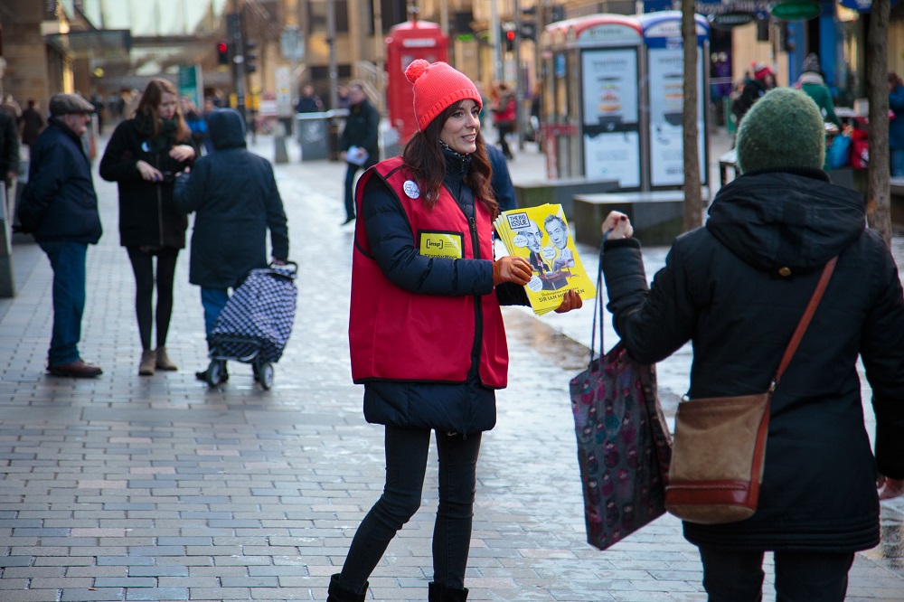 Maree sells The Big Issue during a 'Big Sell' event during Vendor Week in 2016 to raise money for INSP and street paper vendors. Credit: Euan Ramsay.